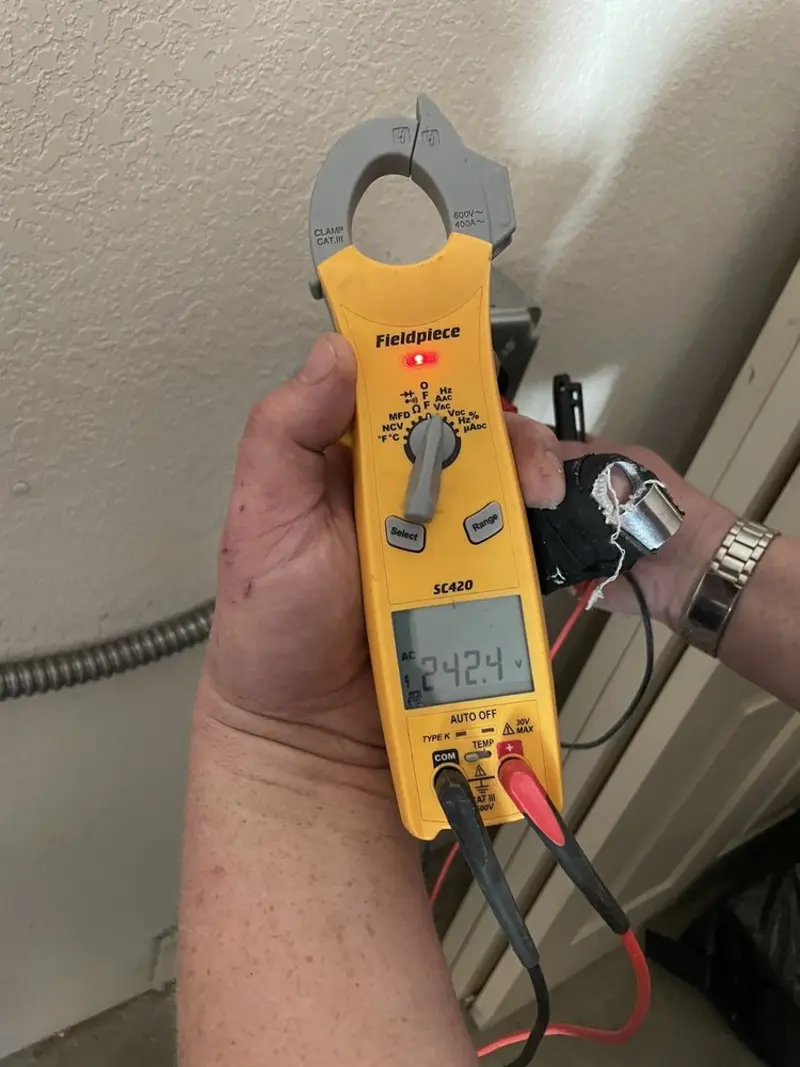 Voltage testing with clamp meter during Ceiling Fan Installation in St. Cloud